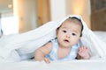 Portrait of a newborn Asian baby on the bed Royalty Free Stock Photo