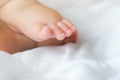 Portrait of a newborn Asian baby boy sleep on the bed , cute selective hand foot feet fingers Royalty Free Stock Photo