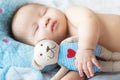 Portrait of  newborn Asian baby boy sleep on the bed , cute selective hand foot feet fingers Royalty Free Stock Photo