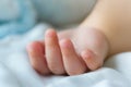 Portrait of newborn Asian baby boy sleep on the bed , cute selective hand foot feet fingers Royalty Free Stock Photo