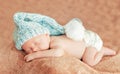 portrait of Newborn baby boy lying on bed, peacefully sleeping on stomach, close up Royalty Free Stock Photo