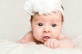 Portrait of newborn baby girl with white headband Royalty Free Stock Photo