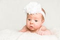 Portrait of newborn baby girl with white headband Royalty Free Stock Photo
