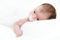 Portrait newborn baby lying in bed