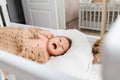 Portrait of a newborn crying baby in the cradle Royalty Free Stock Photo