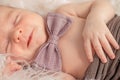 A portrait newborn lies on a fur blanket, cute, sleeping, tiny baby. Mom and her baby. Maternity. Beautiful conceptual image Royalty Free Stock Photo