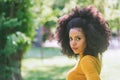 Portrait of nice afro girl in a garden. Close up.