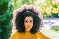 Portrait of nice afro girl in a garden. Close up.