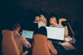 Portrait of nice attractive focused skilled professional guys business people working at night difficult task solving