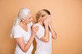 Portrait of nice attractive gloomy grumpy moody worried ladies wearing white outfit granny mom supporting grandchild