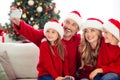 Portrait of nice attractive lovely adorable big full cheerful cheery family small little kids sitting on sofa taking Royalty Free Stock Photo