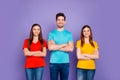 Portrait of nice attractive lovely charming cheerful cheery content guys wearing colorful t-shirts jeans denim crossed Royalty Free Stock Photo