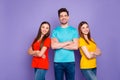 Portrait of nice attractive lovely charming cheerful cheery content guys wearing colorful t-shirts jeans denim Royalty Free Stock Photo