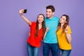 Portrait of nice attractive lovely cheerful cheery glad guys wearing colorful t-shirts jeans taking making selfie Royalty Free Stock Photo