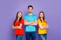 Portrait of nice attractive lovely cheerful cheery glad successful content guys wearing colorful t-shirts jeans denim Royalty Free Stock Photo