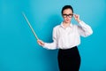 Portrait of nice attractive smart stylish teacher pointing wooden stick isolated over bright blue color background Royalty Free Stock Photo