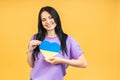 Portrait of nice beautiful lovely glad cheerful woman holding in hands Ukrainian flag having fun isolated over yellow pastel color Royalty Free Stock Photo