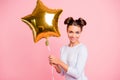 Portrait of nice cute lovable adorable attractive lovely cheerful cheery positive girl holding big air baloon golden