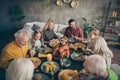 Portrait of nice idyllic cheerful cheery big full family couples brother sister eating domestic fresh delicious meal