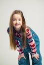 Portrait of a nice little girl. kid smiles. child model posing in the studio. fashion photography Royalty Free Stock Photo