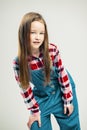 Portrait of a nice little girl. kid smiles. child model posing in the studio. fashion photography Royalty Free Stock Photo