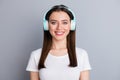 Portrait of nice pretty lovely girl have wireless head phones ear phones enjoy listen music song wear good look outfit Royalty Free Stock Photo