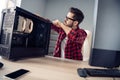 Portrait of nice skilled focused trendy guy repairing detail pc upgrade process cooling fan at office work workplace