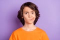 Portrait of nice unsure boy creating solution overthinking smirk isolated over violet purple color background Royalty Free Stock Photo