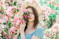 Portrait of nice young girl  close eyes by flowers, take a rest in blooming apple garden Royalty Free Stock Photo