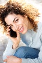 North African woman smiling and talking on mobile phone Royalty Free Stock Photo