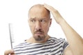 Caucasian bald man and comb Royalty Free Stock Photo