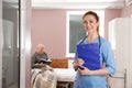 Portrait of nurse with clipboard in patient`s hospital ward Royalty Free Stock Photo