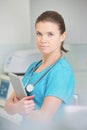 Portrait of nurse with digital tablet standing at clinic Royalty Free Stock Photo