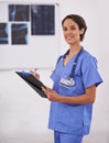 Portrait, nurse and happy woman writing on checklist in hospital for healthcare, wellness and service. Doctor, smile or