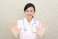 Female nurse making stop sign Royalty Free Stock Photo