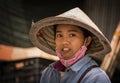 Portrait o a young Vietnamese girl wearing traditional conical hat