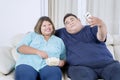 Portrait of obese Asian couple taking a selfie