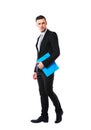 Portrait od a businessman standing with blue folder Royalty Free Stock Photo