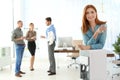 Portrait of office employee with glass near water cooler Royalty Free Stock Photo