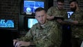 Portrait officer men in camouflage uniform, in system control center, cyber security, tracking safeness, terrorists