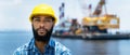 Portrait of offshore worker with digger and ocean Royalty Free Stock Photo