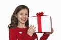 Portrait ofHappy Beautiful cheerful little girl in red dress holding big present  gift Royalty Free Stock Photo
