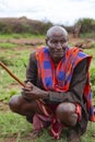 Portrait of old african men sitting on a green meadow in Masai tribe village Royalty Free Stock Photo