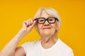 Portrait of an old friendly woman health lifestyle eyeglasses background