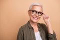 Portrait of old lady deep thinking brainstorming touch eyewear looking empty space smart planning tasks isolated on Royalty Free Stock Photo