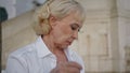 Portrait old lady sitting outdoors looking on newspaper. Mature businesswoman Royalty Free Stock Photo