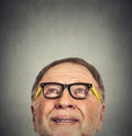 Portrait of Old Man with glasses looking up