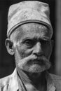 Portrait of a Old man with Warm cap on his head at nandgaon,Uttarpradesh,India Royalty Free Stock Photo