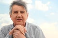 Portrait of old serious senior in striped shirt Royalty Free Stock Photo