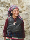 Portrait of a old smiling nepalese woman in national clothes near her